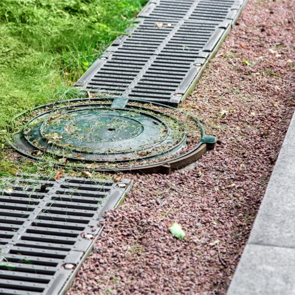 round-manhole-cover-of-drainage-system-on-the-side-2025-10-10-16-42-37-utc