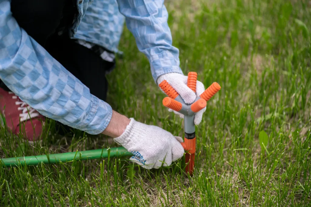 sprinkler head inspection and adjustment during irrigation repair in 30A Florida 