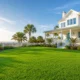 lawn-care-in-30a-florida-featured Lush green St. Augustine grass lawn at a coastal 30A Florida beach house — professional lawn care in 30A Florida